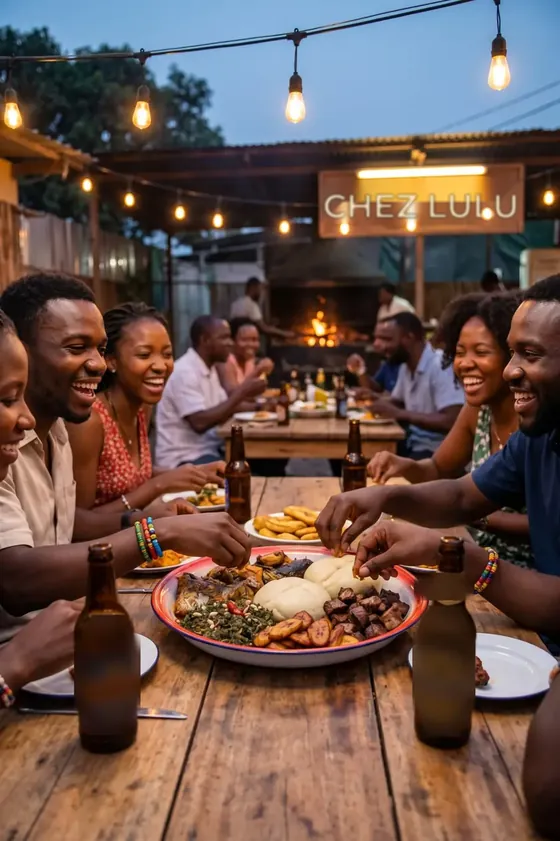 Tablée d'amis autour d'un plat de saka-saka, viande, bananes plantains et chikwangue